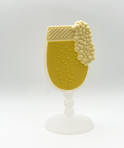 Soft silicone baby teether displayed upright on a white background with textured details