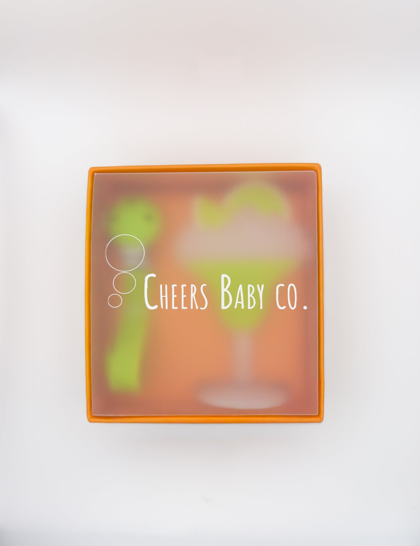 Cheers Baby Co. gift box with soft silicone teether design visible through the packaging on a white background.