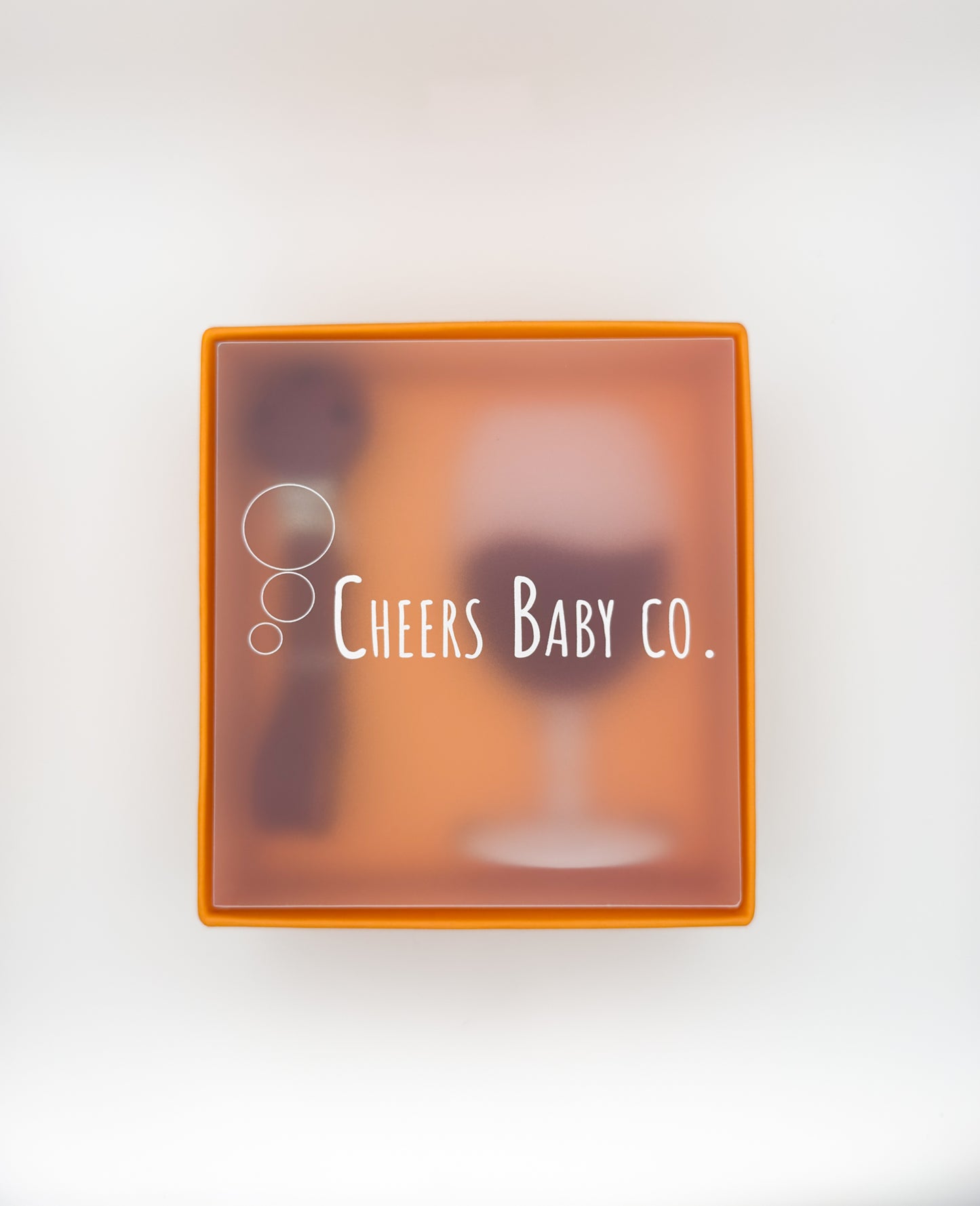 Cheers Baby Co. gift box with soft silicone teether design visible through the packaging on a white background