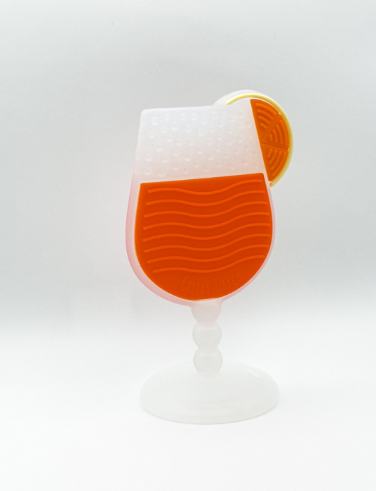 Soft silicone baby teether displayed upright on a white background with textured details