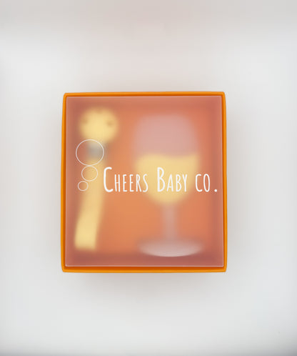 Cheers Baby Co. gift box with soft silicone teether design visible through the packaging on a white background